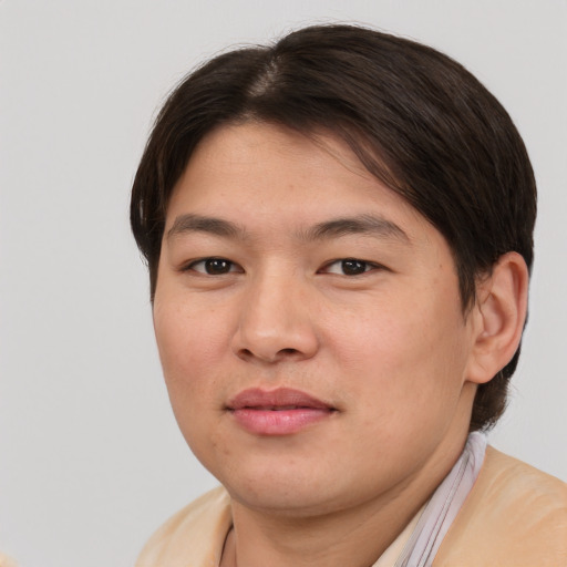 Joyful asian young-adult male with short  brown hair and brown eyes