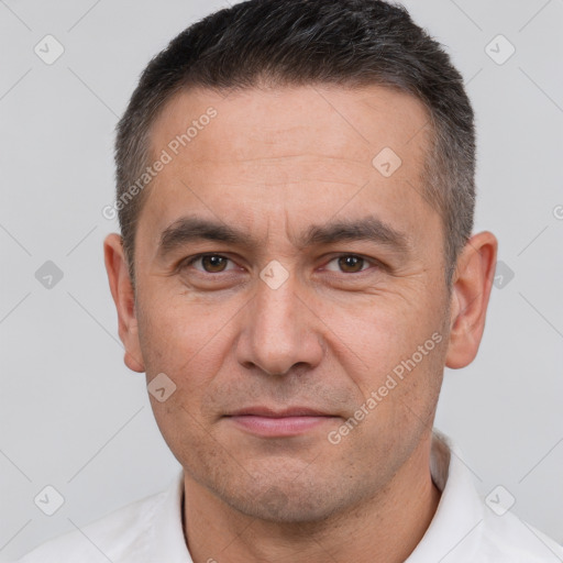 Joyful white adult male with short  brown hair and brown eyes