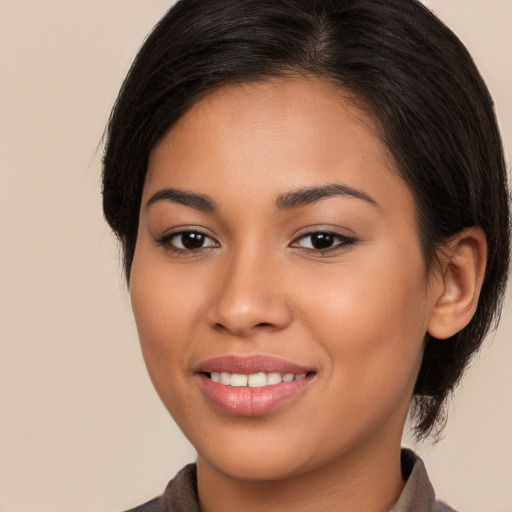 Joyful white young-adult female with medium  brown hair and brown eyes