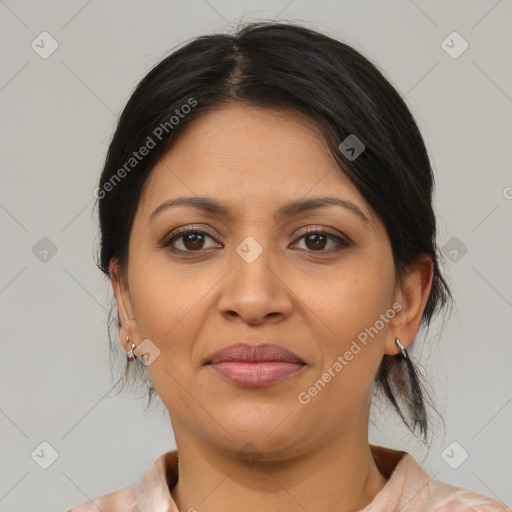 Joyful latino young-adult female with medium  brown hair and brown eyes