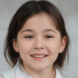 Joyful white child female with medium  brown hair and brown eyes