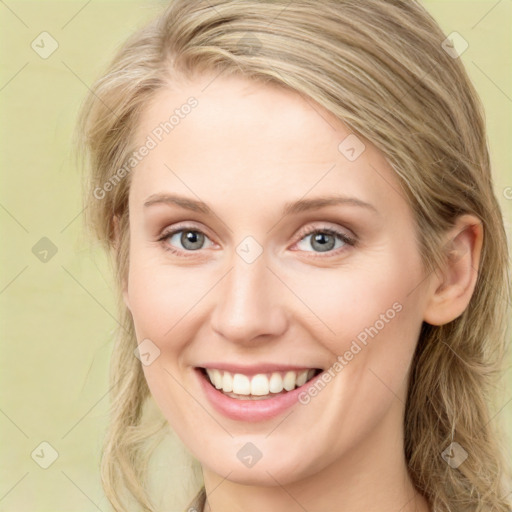 Joyful white young-adult female with long  brown hair and green eyes