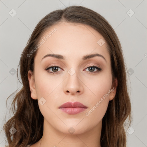 Neutral white young-adult female with long  brown hair and brown eyes