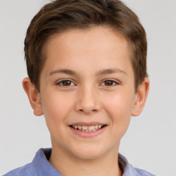 Joyful white child male with short  brown hair and brown eyes