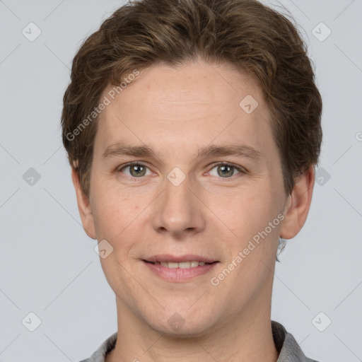 Joyful white adult male with short  brown hair and grey eyes