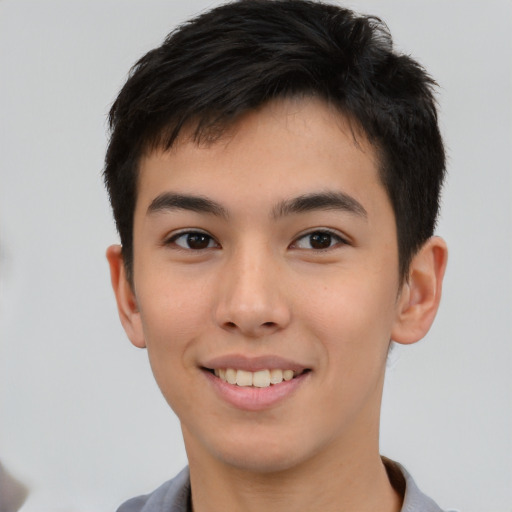 Joyful asian young-adult male with short  black hair and brown eyes