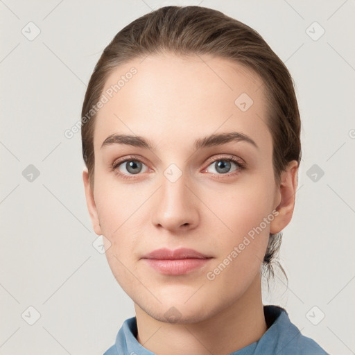 Neutral white young-adult female with medium  brown hair and grey eyes