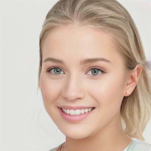 Joyful white young-adult female with long  brown hair and blue eyes