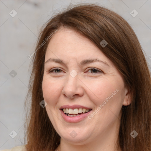 Joyful white adult female with medium  brown hair and brown eyes