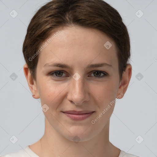 Joyful white young-adult female with short  brown hair and grey eyes