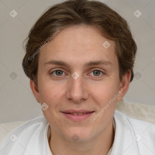 Joyful white adult female with short  brown hair and grey eyes