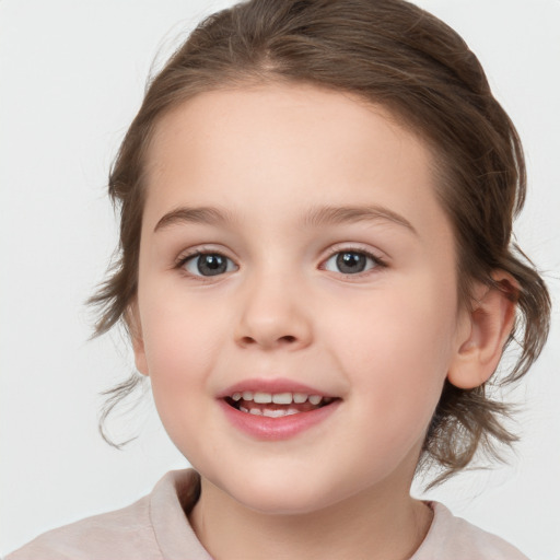 Joyful white child female with medium  brown hair and grey eyes