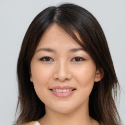 Joyful asian young-adult female with medium  brown hair and brown eyes