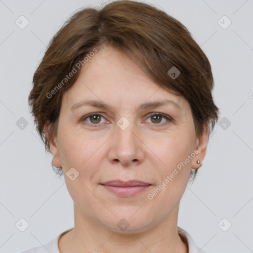 Joyful white adult female with short  brown hair and brown eyes