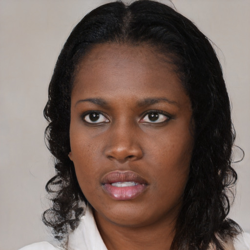 Neutral black young-adult female with medium  black hair and brown eyes