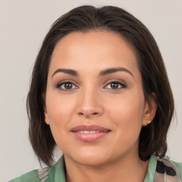 Joyful white young-adult female with medium  brown hair and brown eyes