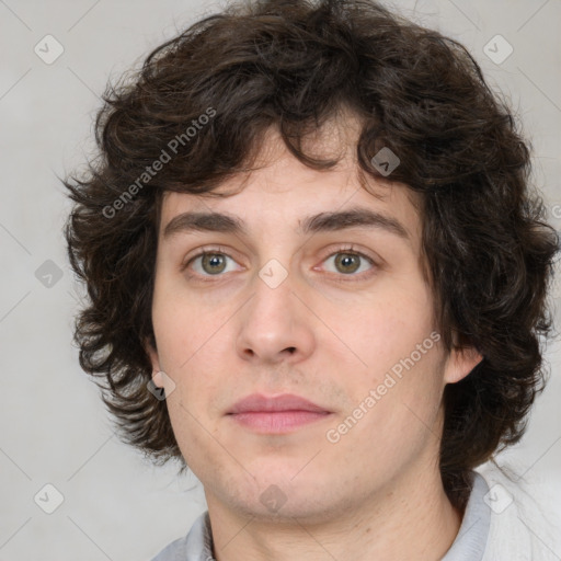 Joyful white young-adult male with medium  brown hair and brown eyes