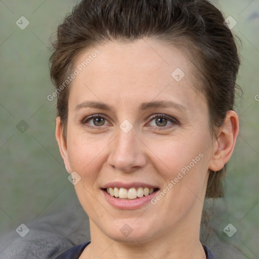 Joyful white adult female with short  brown hair and brown eyes