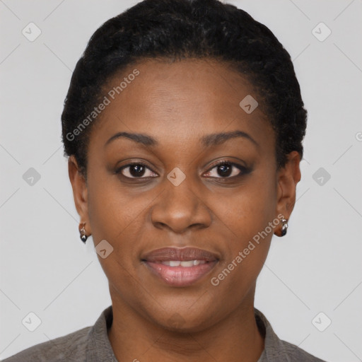 Joyful black young-adult female with short  black hair and brown eyes