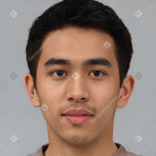 Neutral latino young-adult male with short  brown hair and brown eyes