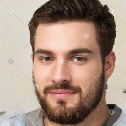 Neutral white young-adult male with short  brown hair and brown eyes