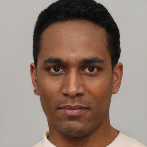 Neutral black young-adult male with short  black hair and brown eyes