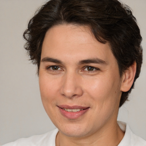 Joyful white adult female with medium  brown hair and brown eyes