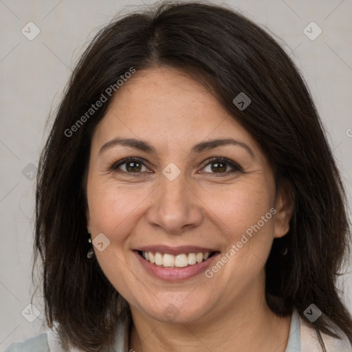 Joyful white adult female with medium  brown hair and brown eyes