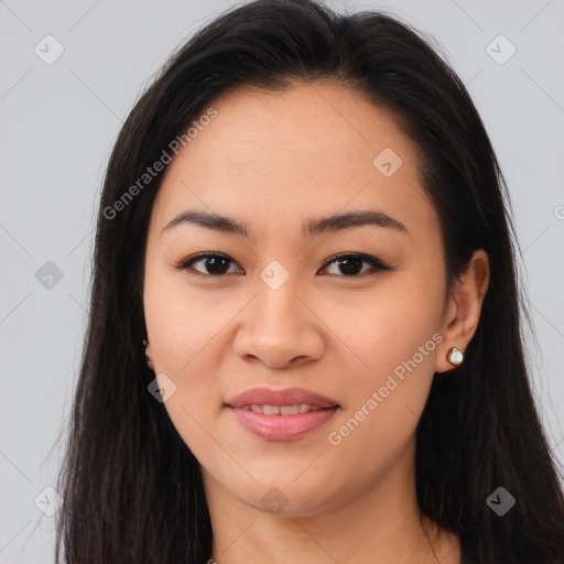 Joyful asian young-adult female with long  brown hair and brown eyes