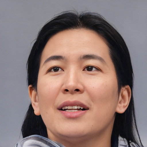 Joyful asian young-adult female with medium  black hair and brown eyes