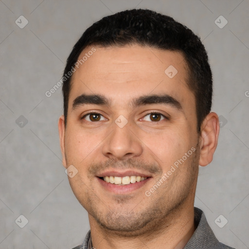 Joyful white young-adult male with short  black hair and brown eyes