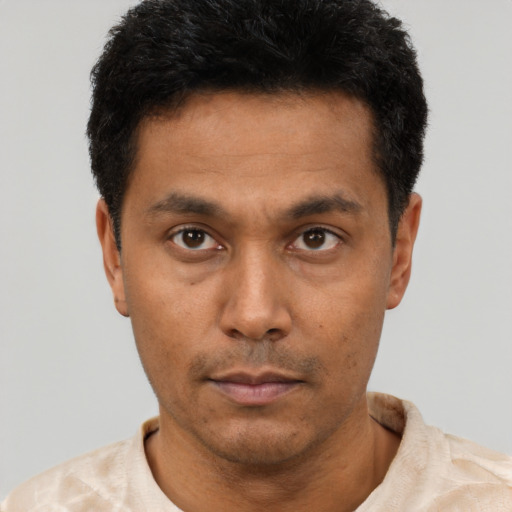 Neutral latino young-adult male with short  black hair and brown eyes
