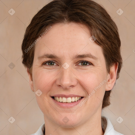 Joyful white young-adult female with medium  brown hair and green eyes