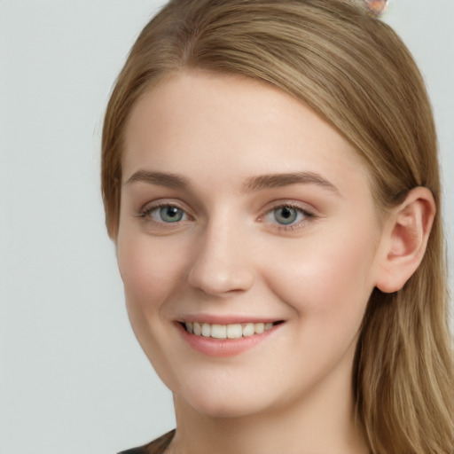 Joyful white young-adult female with long  brown hair and grey eyes