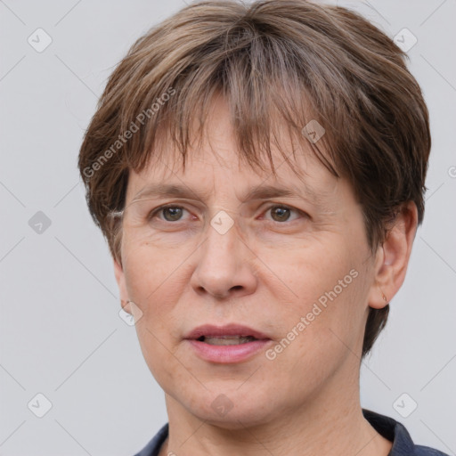 Joyful white adult female with short  brown hair and grey eyes