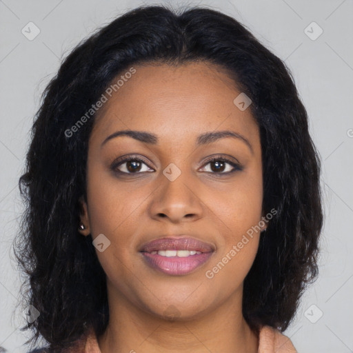 Joyful black young-adult female with long  brown hair and brown eyes