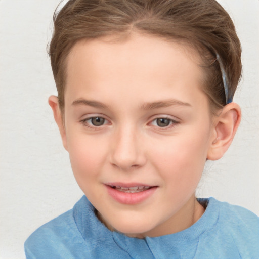 Joyful white child female with short  brown hair and brown eyes