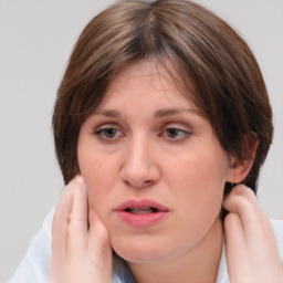 Neutral white young-adult female with medium  brown hair and grey eyes