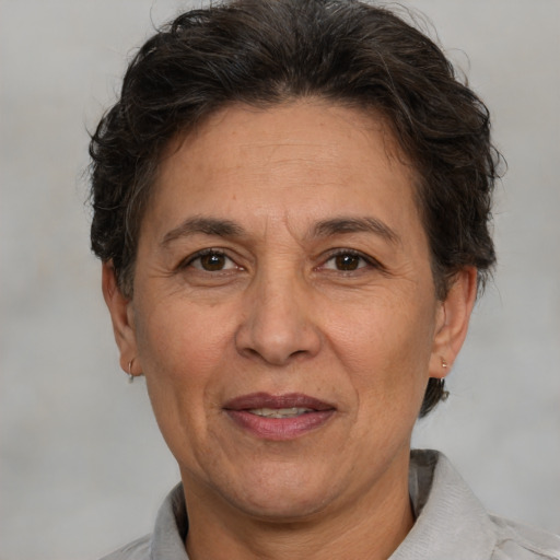 Joyful white middle-aged female with short  brown hair and brown eyes