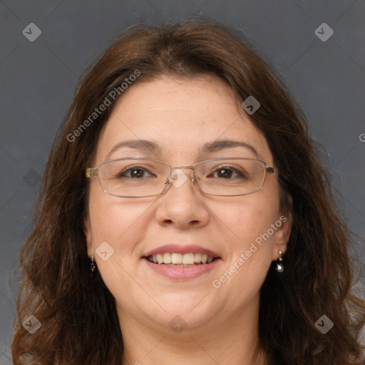 Joyful white adult female with long  brown hair and grey eyes