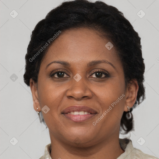 Joyful latino adult female with short  brown hair and brown eyes