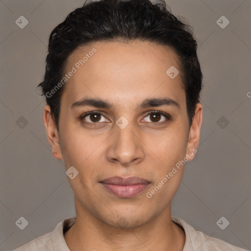 Joyful latino young-adult male with short  brown hair and brown eyes