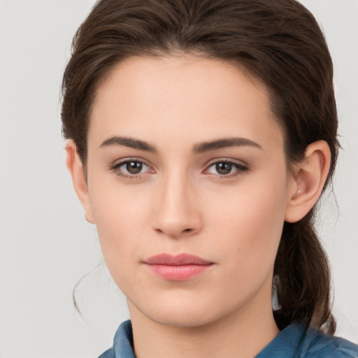 Neutral white young-adult female with medium  brown hair and brown eyes