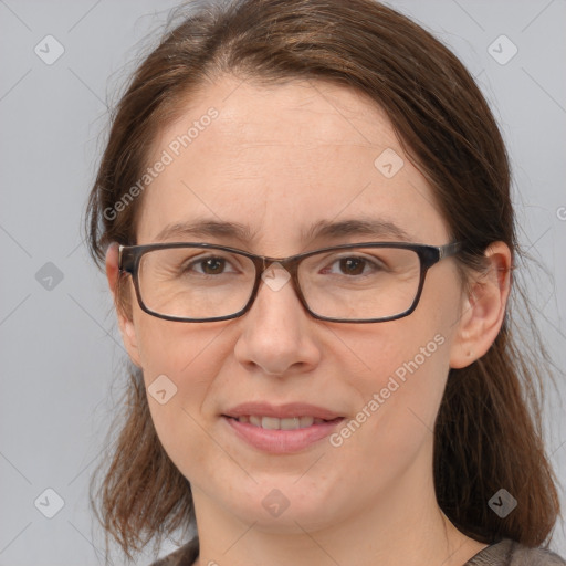 Joyful white adult female with medium  brown hair and brown eyes