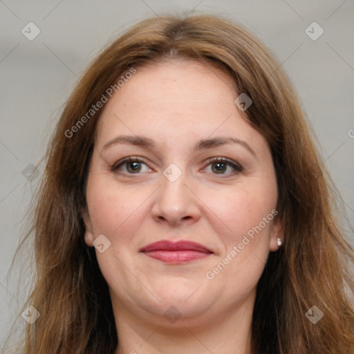 Joyful white adult female with long  brown hair and brown eyes