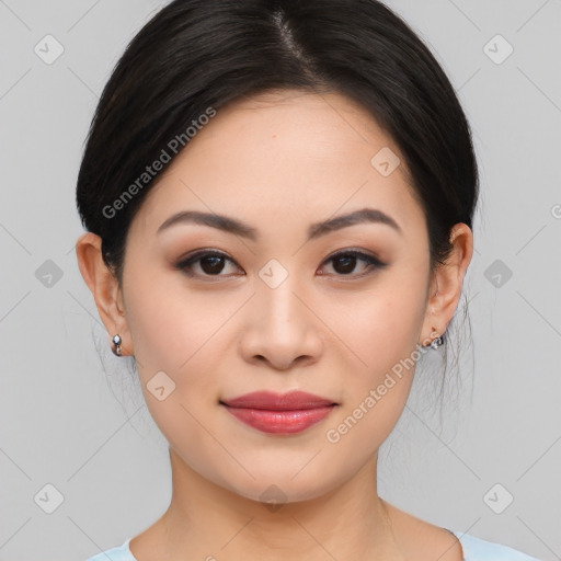 Joyful asian young-adult female with medium  black hair and brown eyes