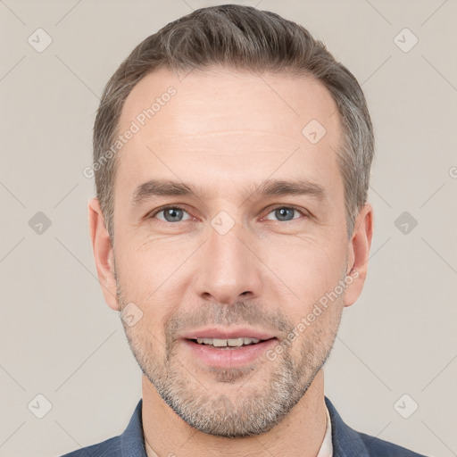 Joyful white adult male with short  brown hair and grey eyes