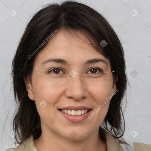 Joyful white adult female with medium  brown hair and brown eyes