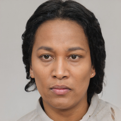 Neutral black adult female with short  black hair and brown eyes