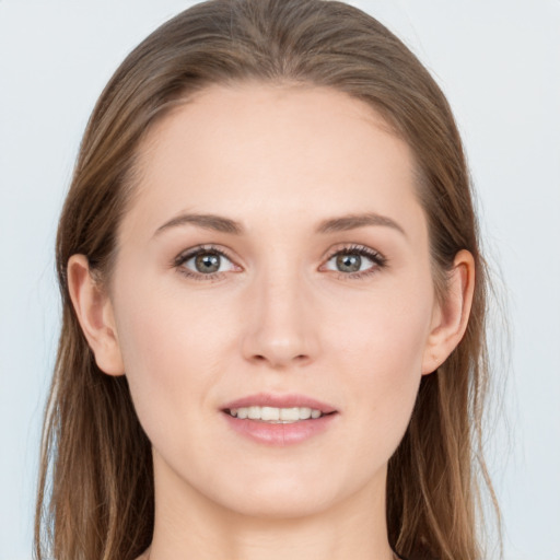 Joyful white young-adult female with long  brown hair and grey eyes